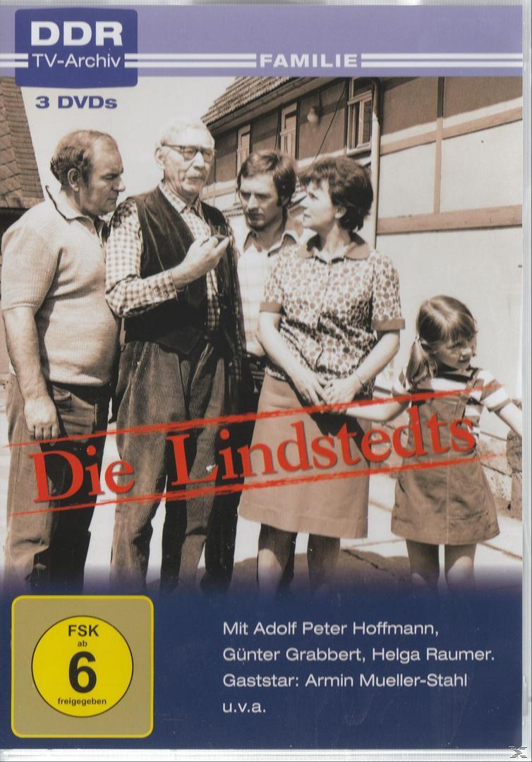 DVD-Cover mit einer Familie, die vor einem Haus steht.