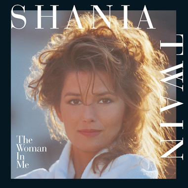 Shania Twain egy borítón, mosolyogva, fehér köntösben.
