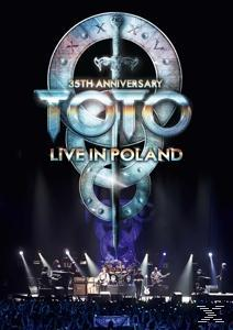 Albumcover für 'Toto Live in Poland' mit Bandlogo und Bühnenbeleuchtung.