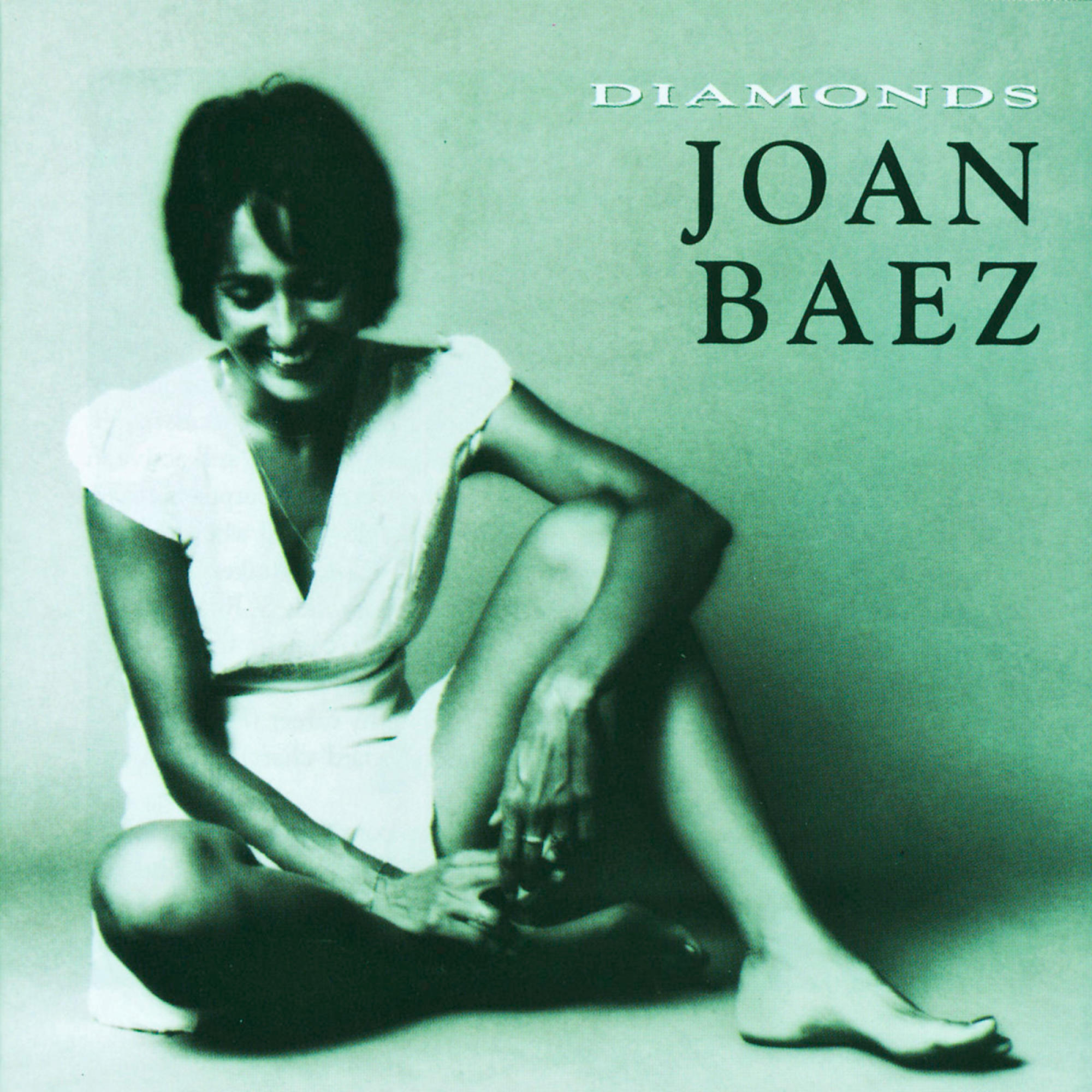 Joan Baez Albumcover, sitzend mit einem Lächeln.