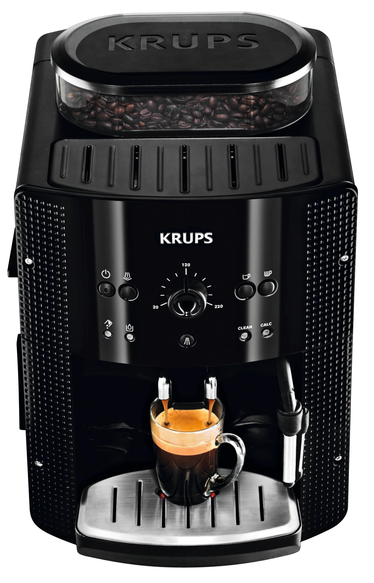 Máquina de café Krups negra con contenedor de granos. Espresso vertiéndose en una taza de vidrio sobre una bandeja plateada.