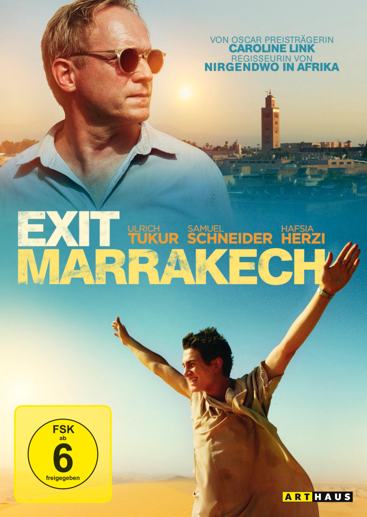 DVD-Cover mit zwei Männern. Einer trägt Sonnenbrille, der andere hebt die Arme. Stadt im Hintergrund.