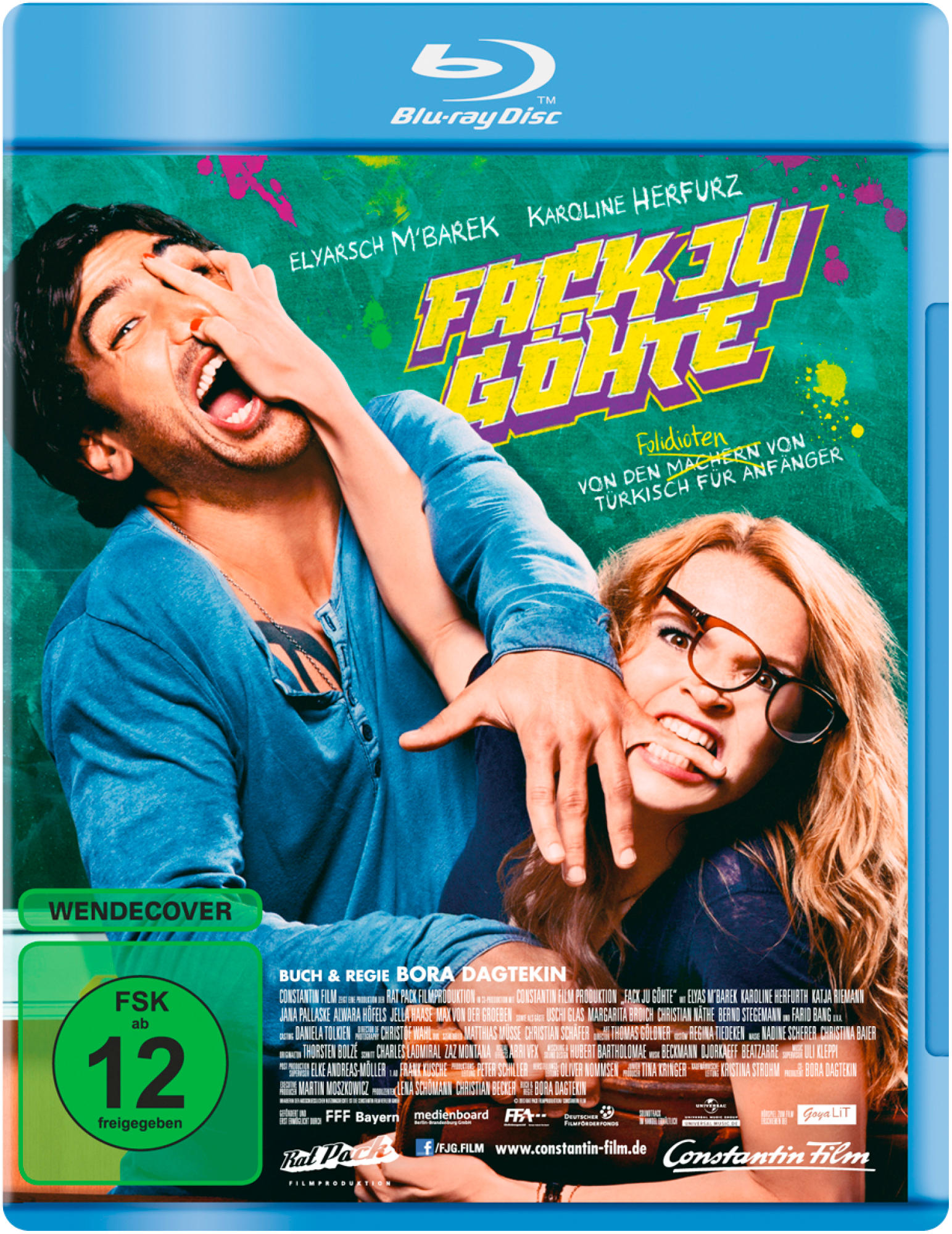 DVD-Cover mit zwei Personen, Text und grünem Hintergrund.