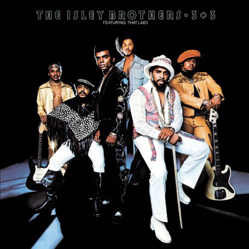 Az Isley Brothers albumának borítója. Hat férfi stílusos ruhában. Gitárok a háttérben. Sötét háttér, felül szöveggel.