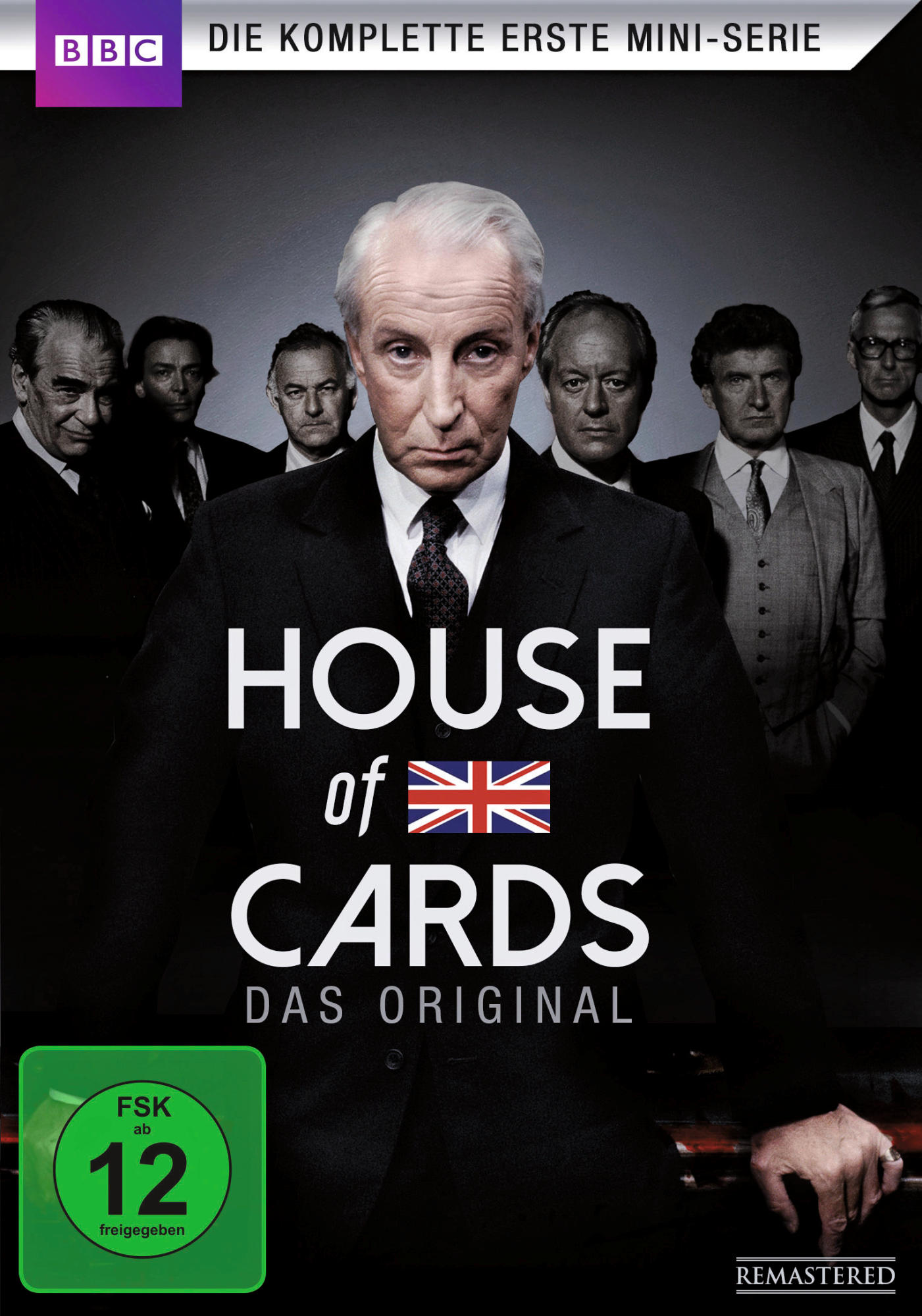 DVD-Cover für 'House of Cards' mit einem Mann im Anzug und anderen Männern. BBC-Logo. Union Jack und FSK-Bewertung.