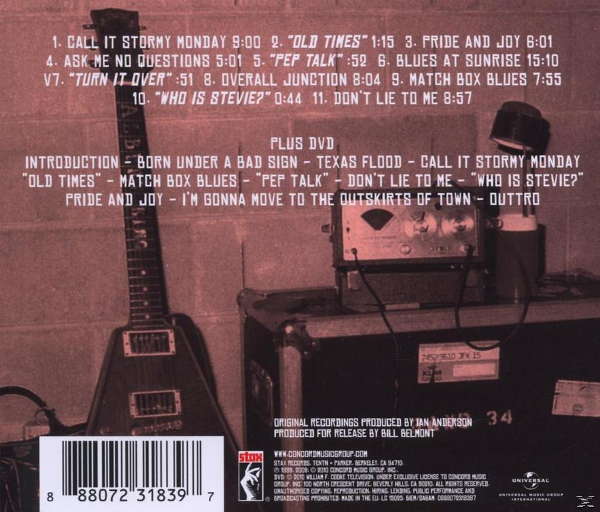 Rückseite eines Musikalbums. Texte und Text auf dem Hintergrund. Eine Gitarre.