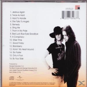 Rückseite einer CD-Hülle mit zwei Männern, einer Titelliste und einer US-Flagge.