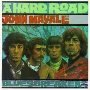 Album borító, John Mayall & The Bluesbreakers. Négy férfi előre néz. Szöveg: A Hard Road.
