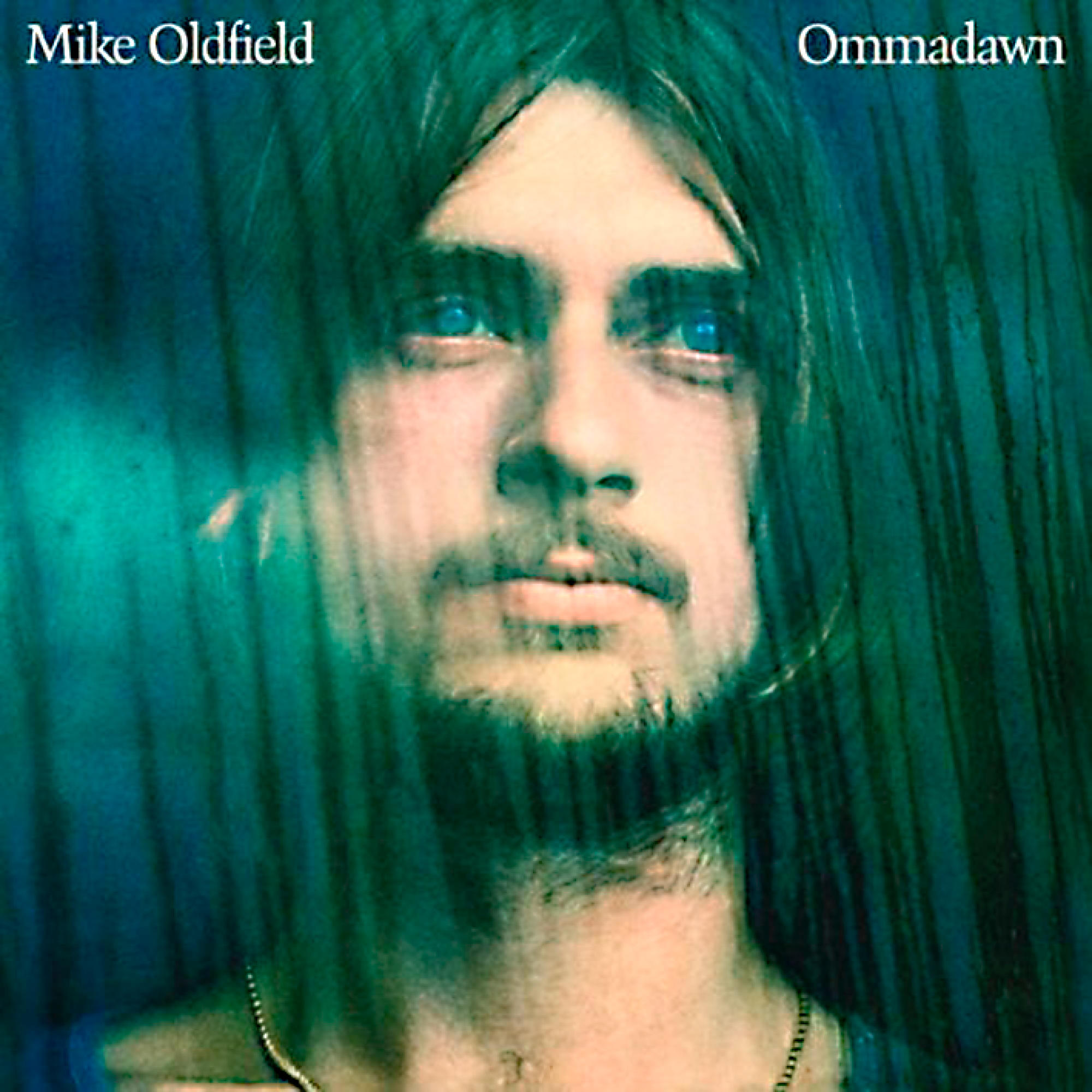 Albumcover: Gesicht eines Mannes mit blauen Augen, Titel: Ommadawn, von Mike Oldfield.