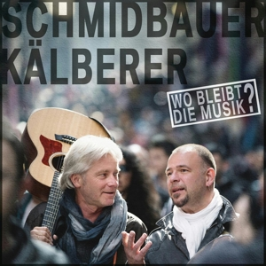 Albumcover mit zwei Männern, einer mit Gitarre, und Text in einer Menschenmenge.