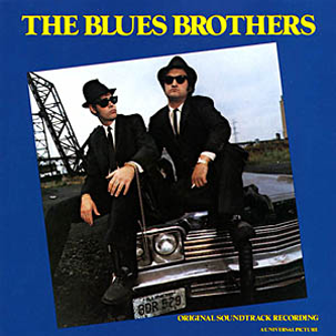 A Blues Brothers album borítója. Két fekete öltönyös, kalapos férfi egy autón.