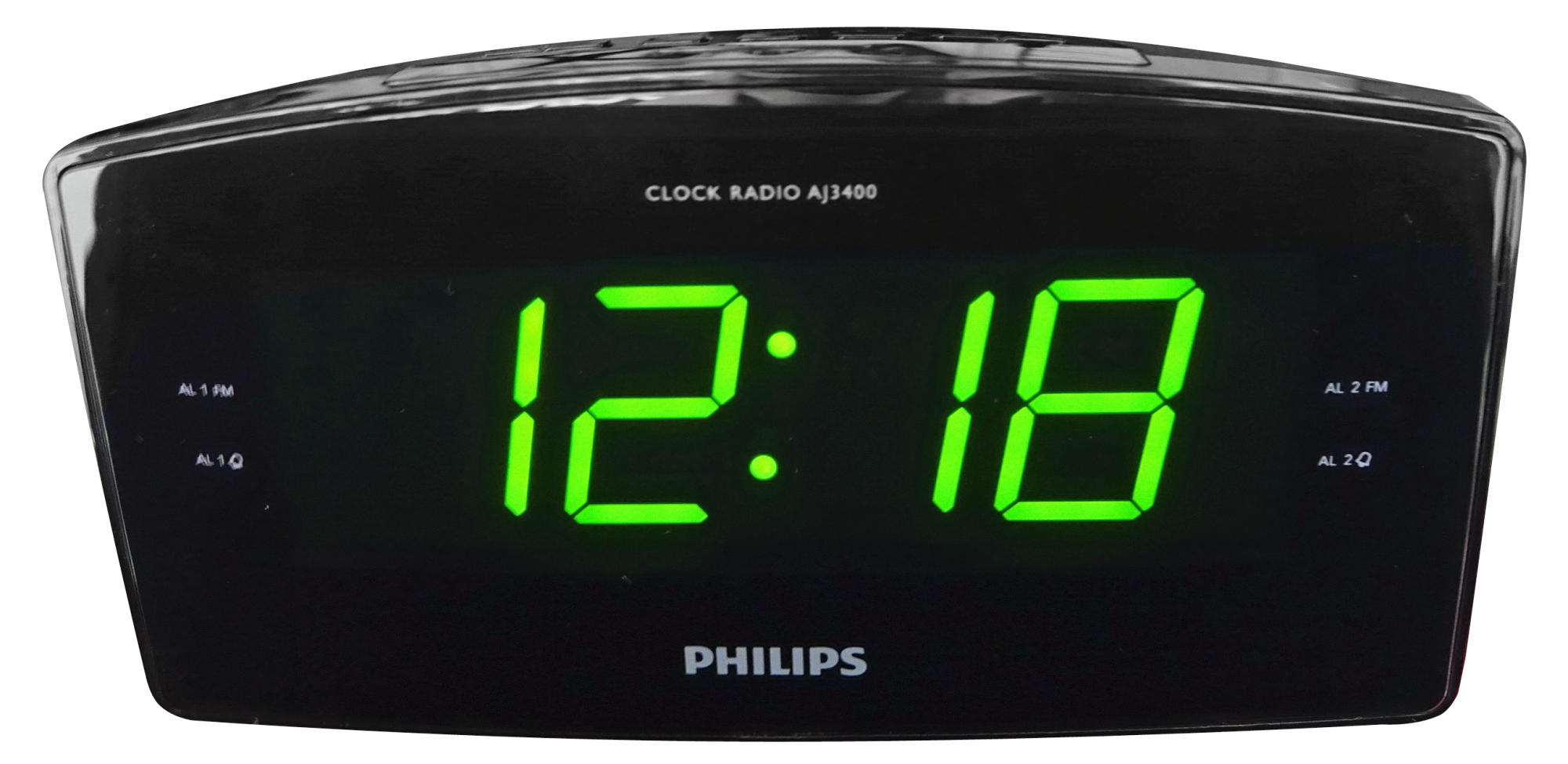 Siyah dijital radyo çalar saat, yeşil rakamlarla 12:18'i gösteriyor. Altta Philips logosu.