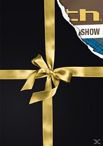 Schwarze Geschenkbox mit goldenem Band und Schleife. Ein zerrissenes Papier zeigt Logo.