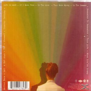CD-Cover mit Regenbogenhintergrund und einer Personensilhouette. Songtitel sind aufgeführt.
