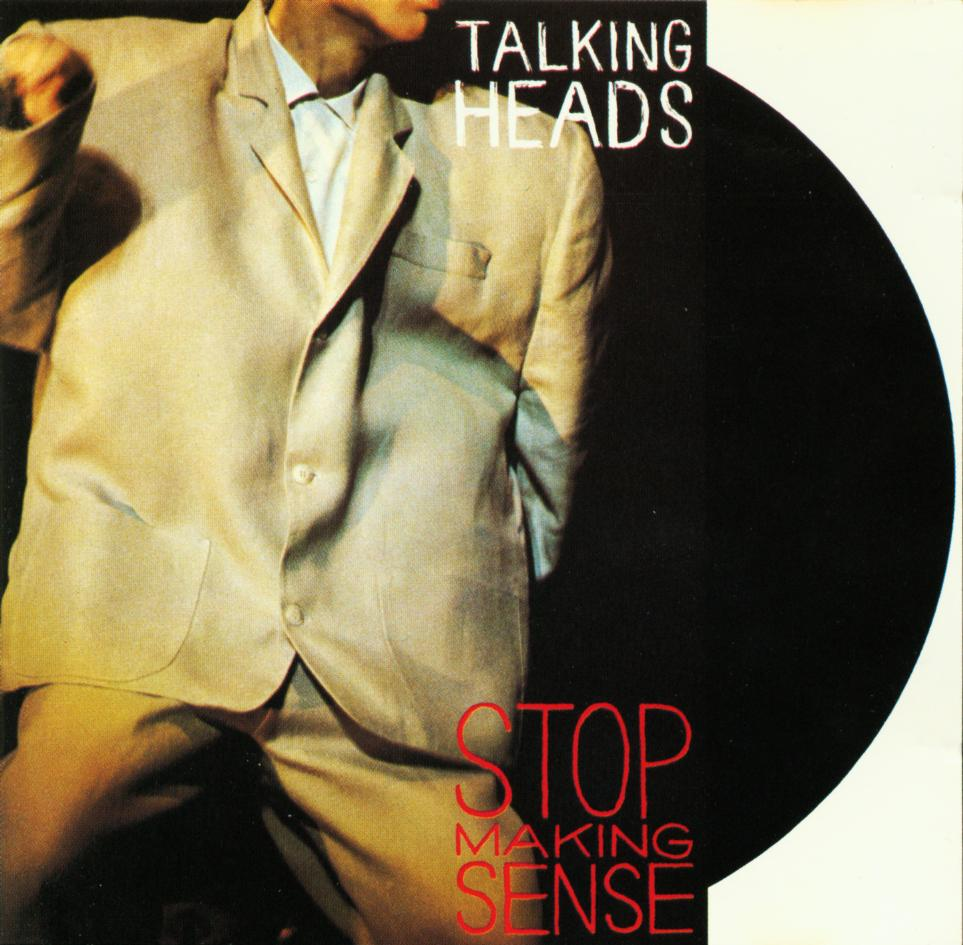 A Talking Heads 'Stop Making Sense' album borítója. Férfi öltönyben, fekete kör és fehér háttér.