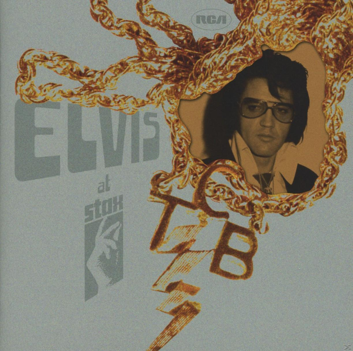 Elvis Albumcover: Elvis in einem Rahmen, goldene Akzente, grauer Hintergrund.