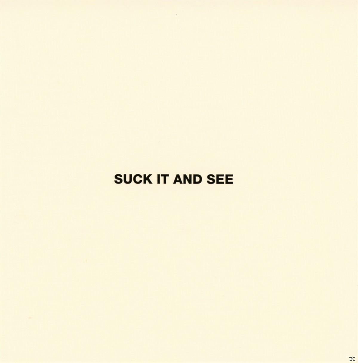 Texte sur fond clair : 'SUCK IT AND SEE'.