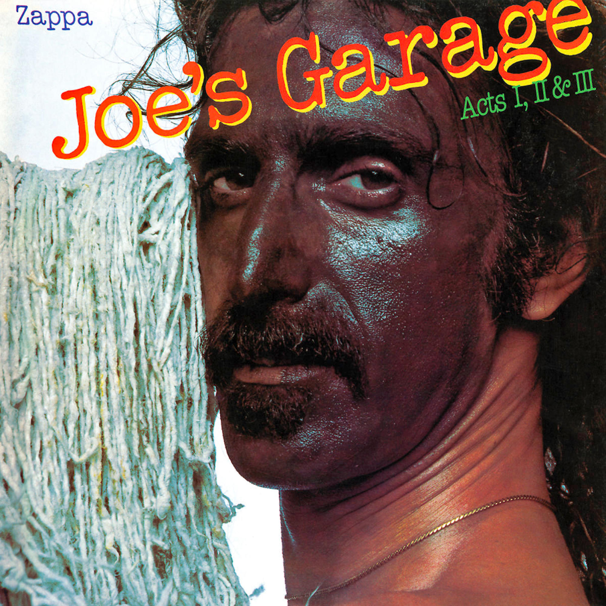 Albumcover für Joe's Garage von Zappa. Ein Mann mit dunklem Make-up und Schnurrbart. Der Titel ist in Rot und Gelb.