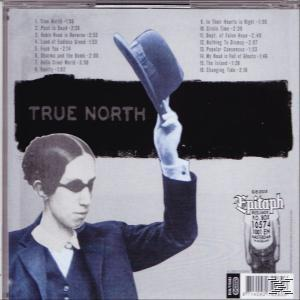 Albumcover-Rückseite. Ein Mann im Anzug und Hut. Albumtitel ist 'True North'.