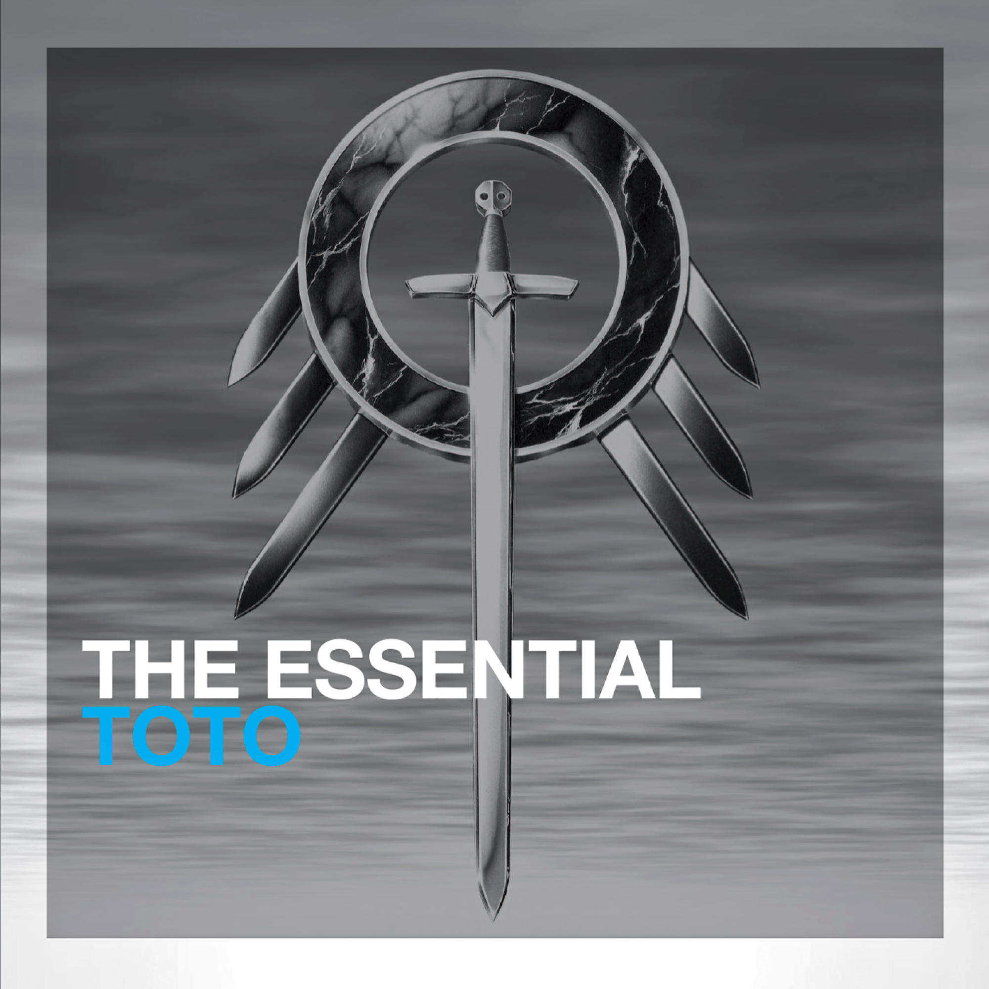 Albumcover mit einem Schwert in der Mitte. Text lautet 'THE ESSENTIAL TOTO'.