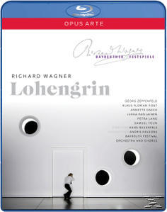 Blu-ray-Cover mit weißer Wand, schwarzen Kreisen und Person. Text: Richard Wagner Lohengrin.