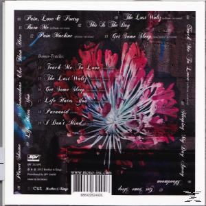CD-Rückseite. Blumenbild in Rosa- und Rottönen, Trackliste und weißer Rand. Text vorhanden.