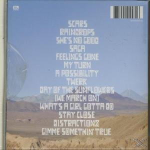 Albumcover mit Titelliste vor Himmel und Berglandschaft.