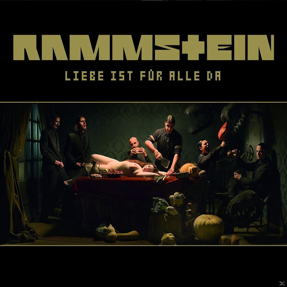 Albumcover. Menschen um einen Tisch mit einer nackten Frau, schneiden Essen. Schwarzer Hintergrund.