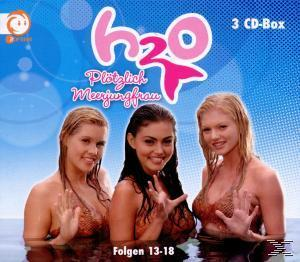 H2O: Plötzlich Meerjungfrau' DVD-Boxset mit drei Frauen im Wasser, Titel und Logo.
