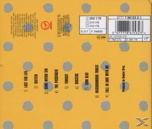 Albumcover, gelber Hintergrund mit grauen Punkten. Text auf der linken Seite. CD-Informationen oben rechts.