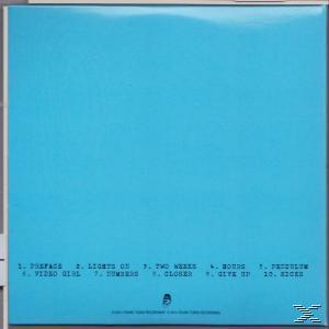Album-Rückseite mit Songtiteln und hellblauem Hintergrund.
