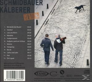 Album-Rückseite. Zwei Männer gehen auf Kopfsteinpflaster, ein schwarzer Hund, Text mit Titelliste.
