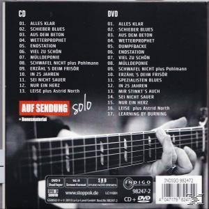 CD-Rückseite mit einem Mann, der Gitarre spielt. Titelliste und Text.