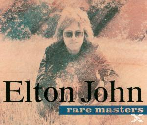 Elton John sitzt im Feld und trägt eine Sonnenbrille. Albumcover mit dem Titel 'Elton John rare masters'.