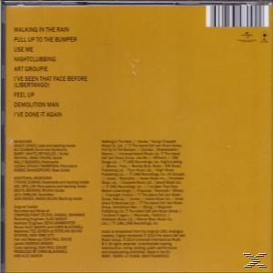 Album-Rückseite, gelber Hintergrund mit Trackliste. Text: Walking In The Rain, Pull Up To The Bumper.