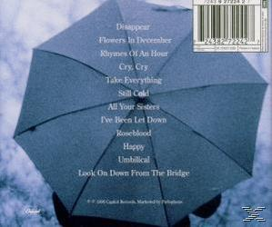 Albumborító egy esernyővel és havas jelenettel, dalok listájával. Az album címe.