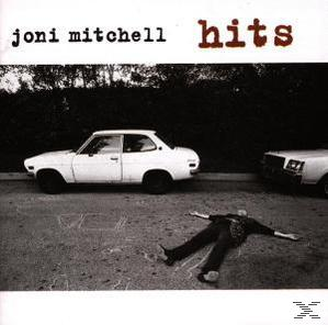 Joni Mitchell 'Hits' című albumának borítója. Egy személy fekszik az úton két autó közelében. Fekete-fehér.