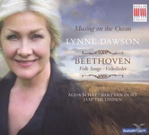 Albumcover einer Frau mit blonden Haaren, die lächelt, mit einem Strand und Meer im Hintergrund.