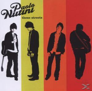 Albumborító négy fekete-fehér figurával. Az album címe: 'These Streets' Paolo Nutinitól.