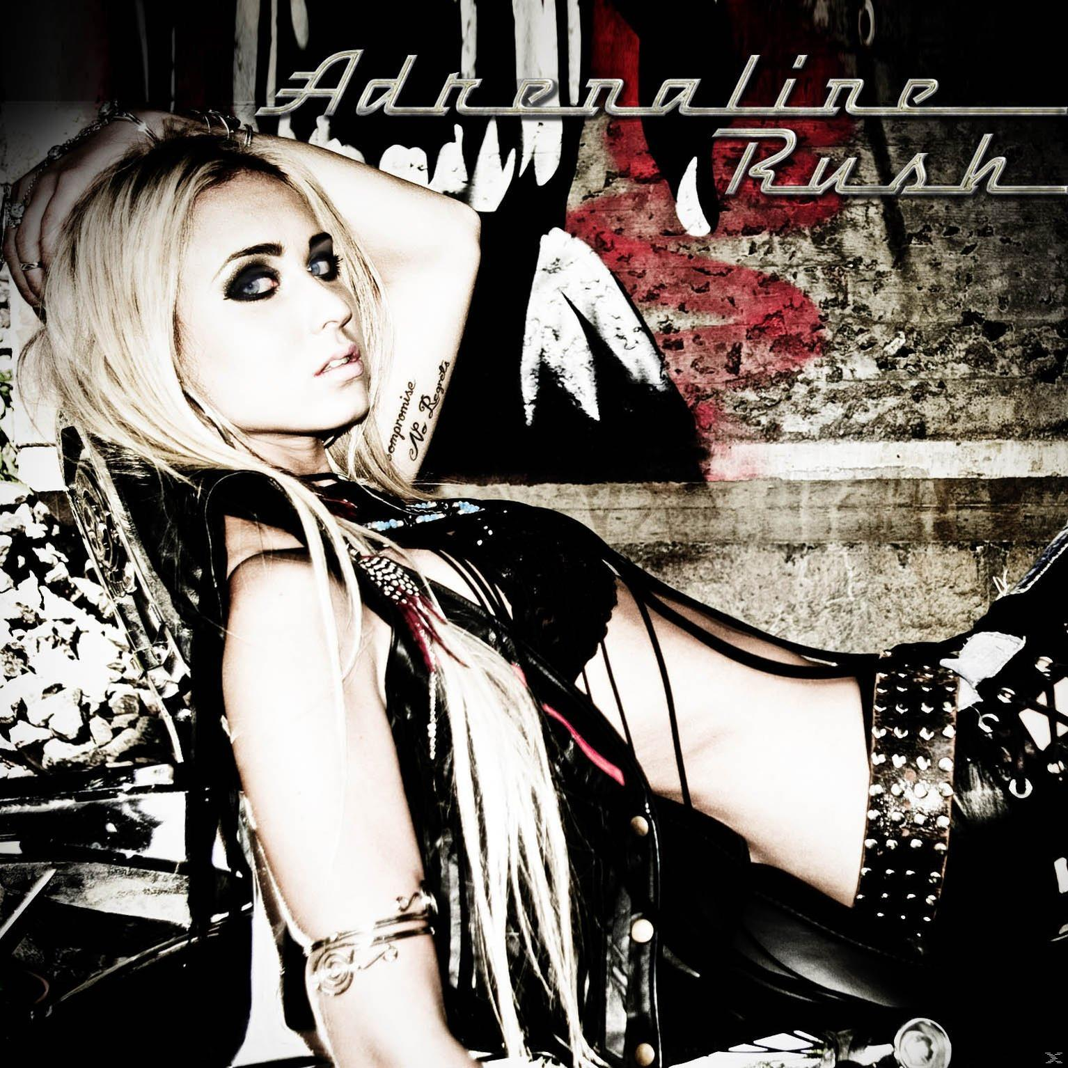 Pochette d'album : Une femme aux cheveux blonds, un haut noir et le titre 'Adrenaline Rush'.