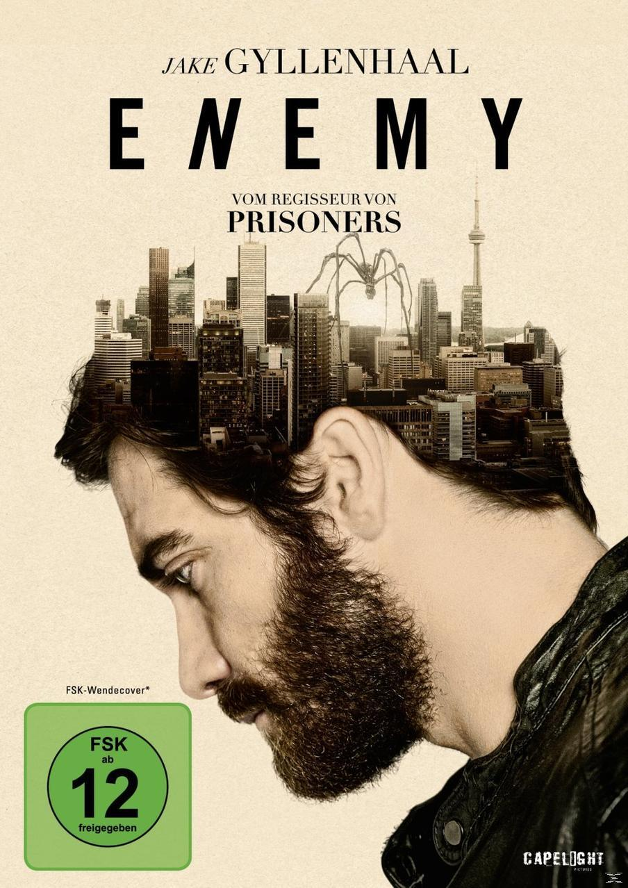 Filmplakat: Gesicht eines Mannes mit Stadt-Overlay, Titel 'Enemy'.