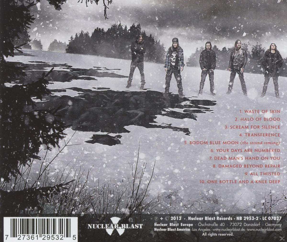 Albumcover mit verschneiter Landschaft und einer Band.