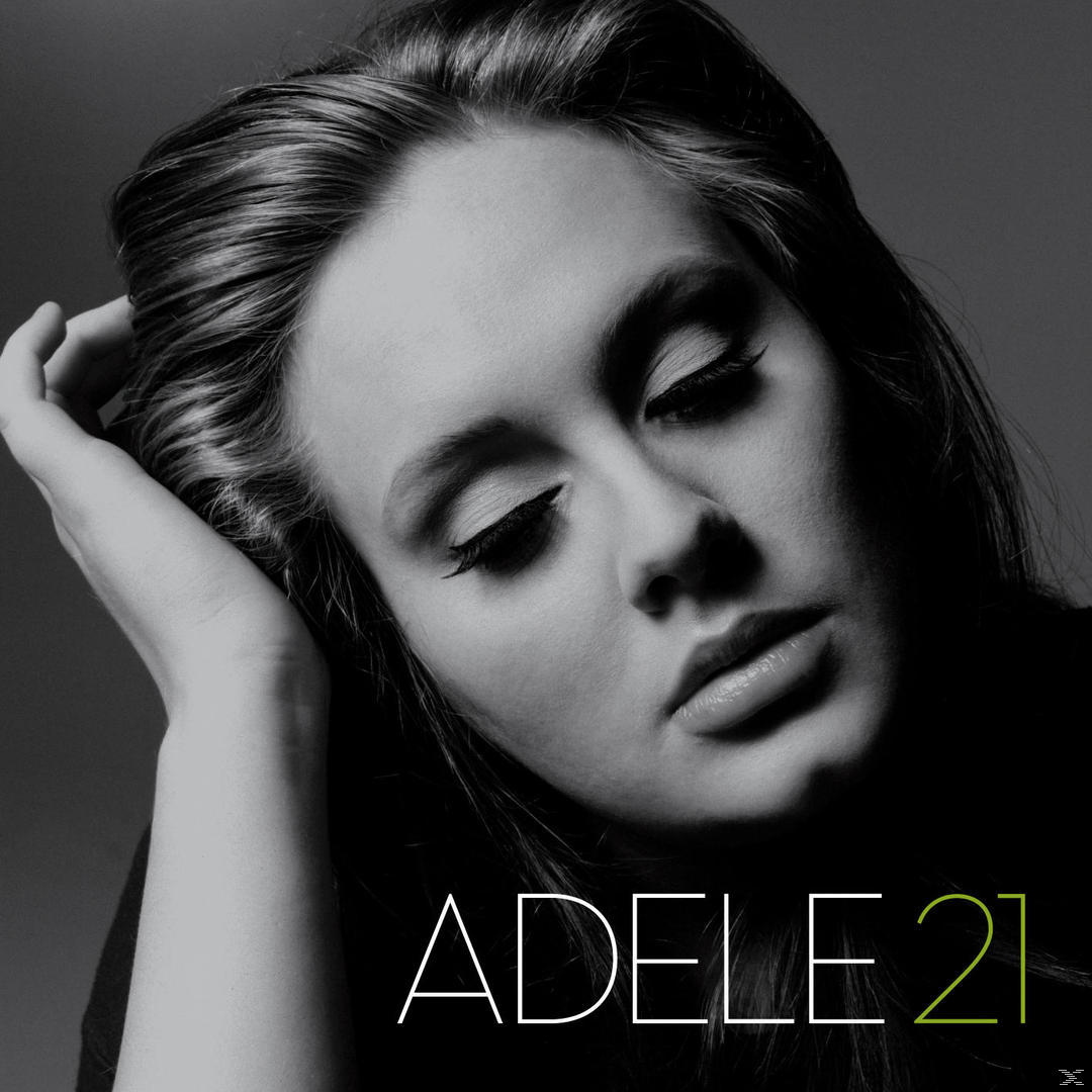 Pochette de l'album Adele 21. Photo en noir et blanc d'Adele, la tête posée sur sa main.
