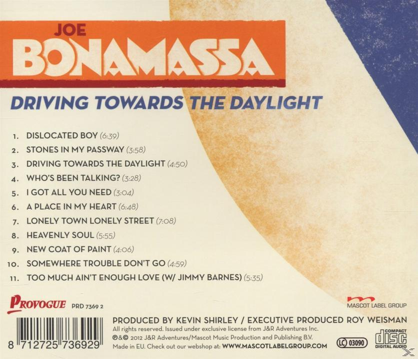 Albumcover, orange und weißer Hintergrund mit Songtiteln.