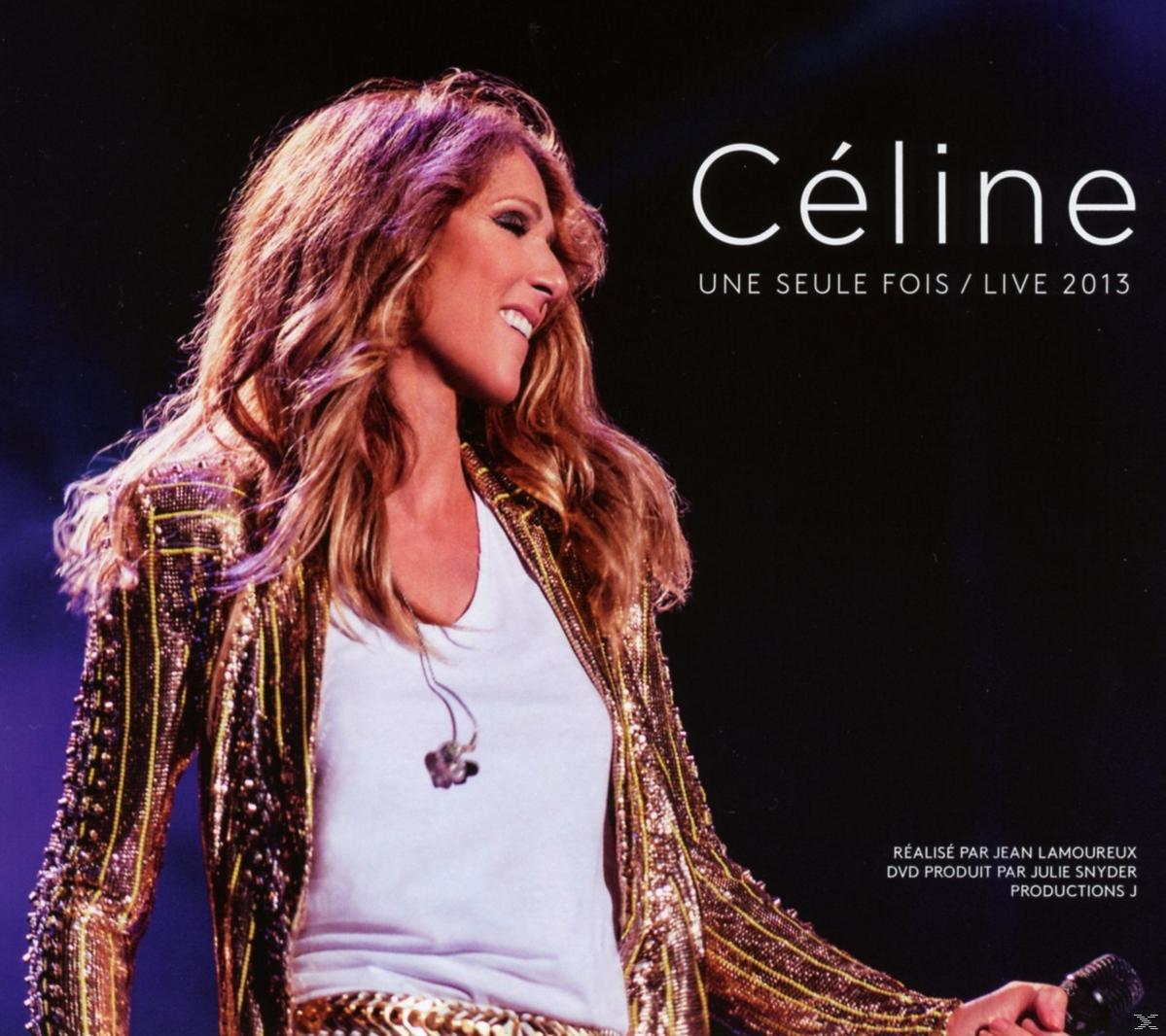 Celine albumhoes. Celine lacht, draagt een gouden jas. Tekst: Celine, Une Seule Fois / Live 2013.
