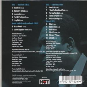 Albumcover mit Profil eines Mannes, Titellisten und einem Barcode.