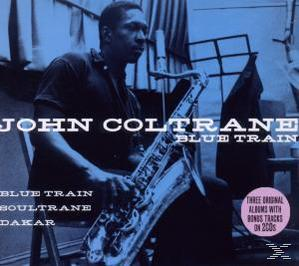 John Coltrane hält ein Saxophon. Das Albumcover trägt den Text 'Blue Train'.
