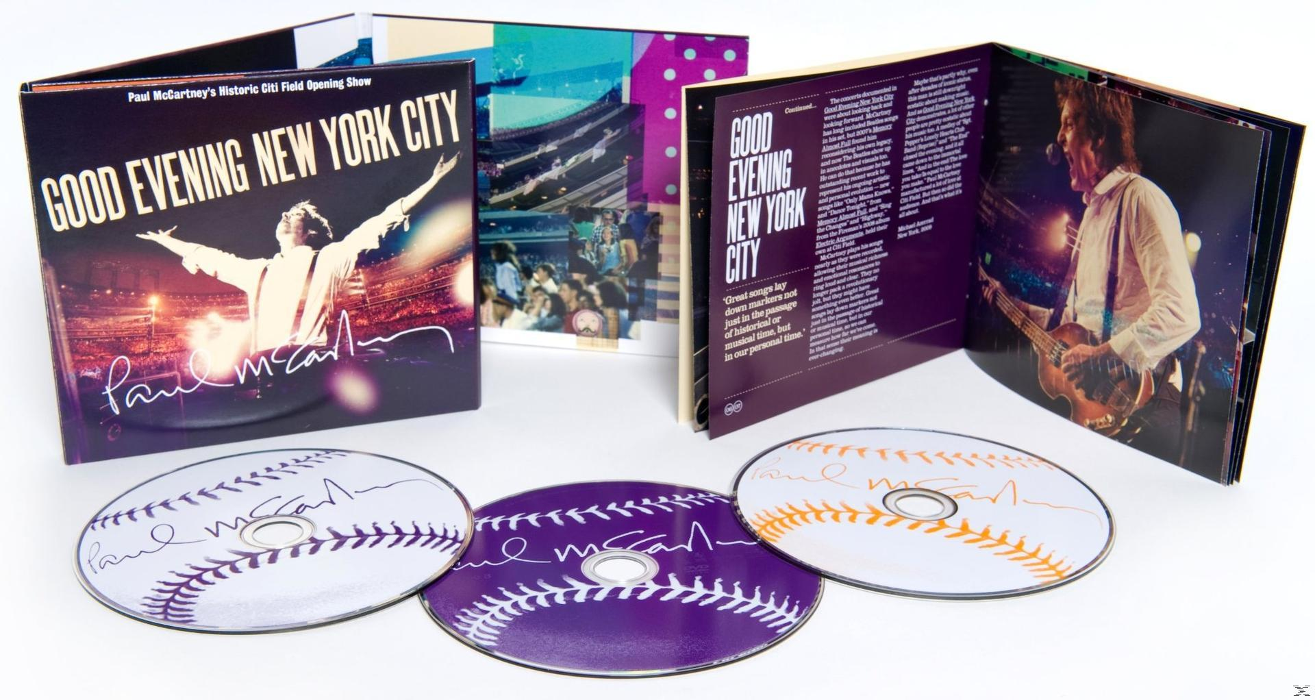 CD-Hülle mit Paul McCartneys Aufführung. Mehrere Discs mit seiner Unterschrift und den Worten 'Good Evening New York City'.