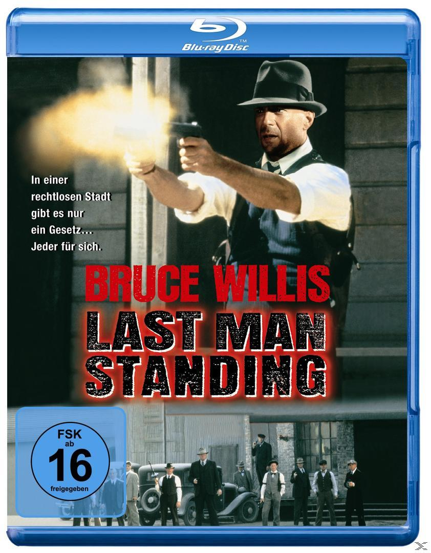 Filmcover: Bruce Willis hält eine Waffe. Titel 'Last Man Standing'. Gruppe von Leuten im Hintergrund.