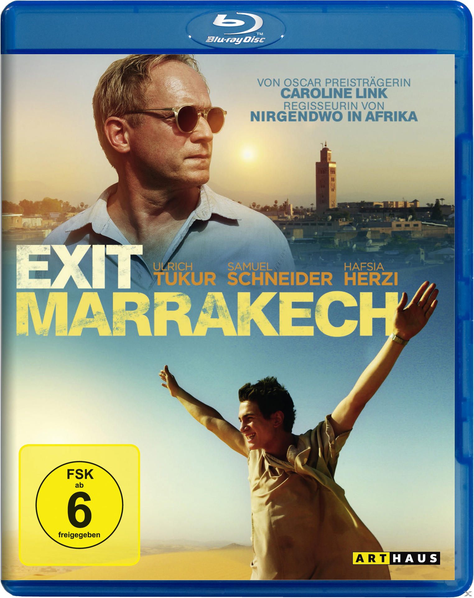 DVD-Cover für den Film "Exit Marrakech", ein Mann, der aus dem Bild blickt. Der Hintergrund ist eine Wüstenlandschaft.